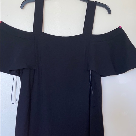 A black Asymmetrical dress. - Picture 2 of 5